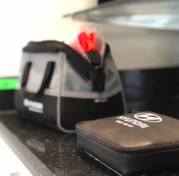 Hyundai-branded accessory and first aid kits on display